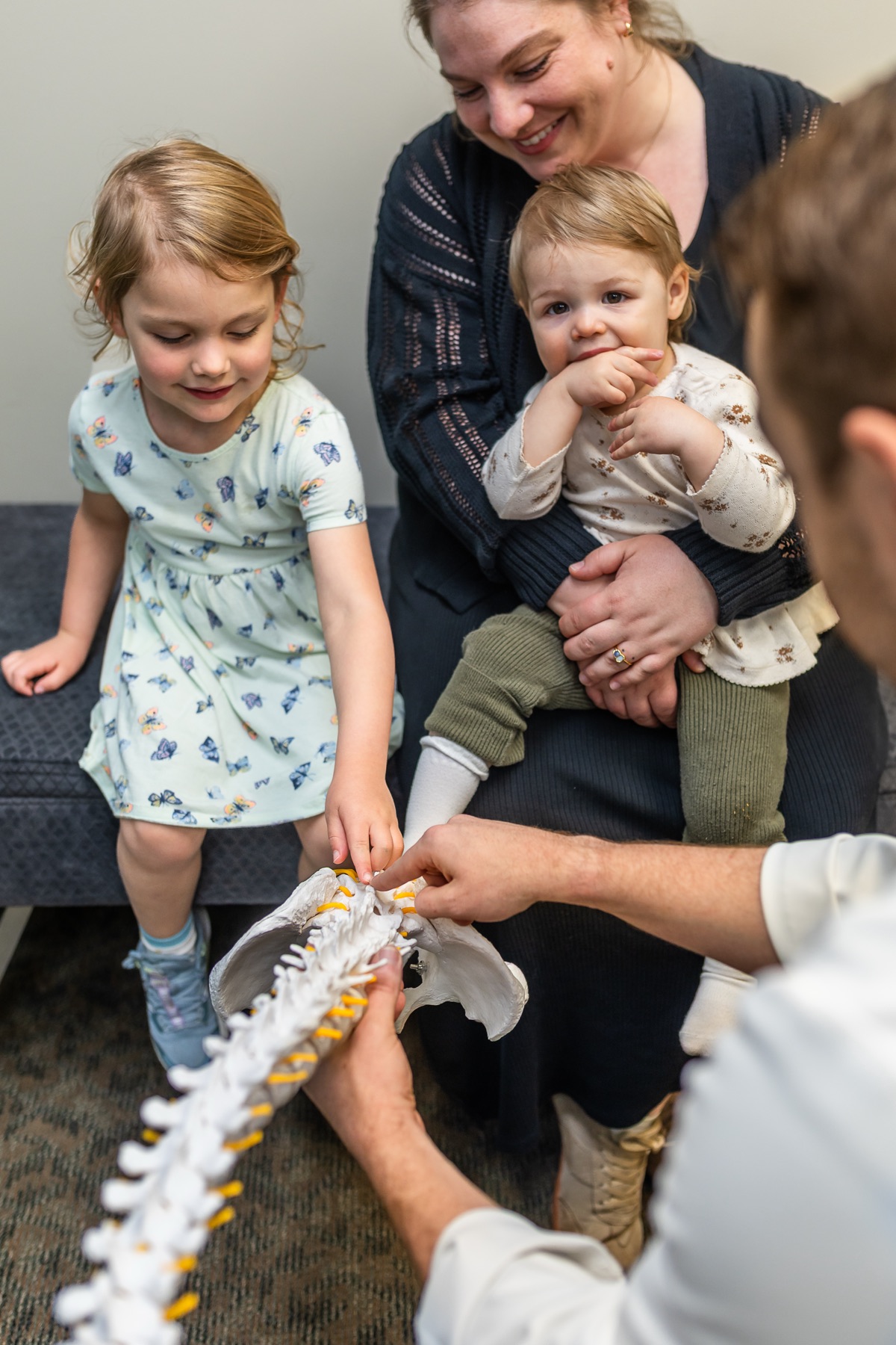 A young patient being gently adjusted at Knapp Family Chiropractic